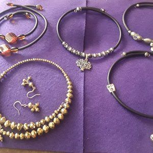 5 memory wire necklaces with black rubber cord. Price for 5 items.